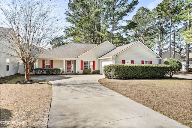 single story home featuring a garage and a front lawn