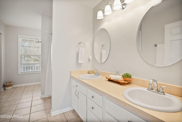 bathroom with tile patterned flooring and vanity