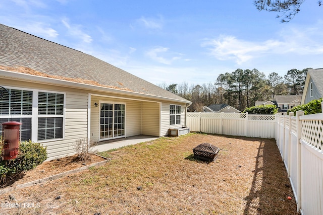 view of yard with a patio and an outdoor fire pit