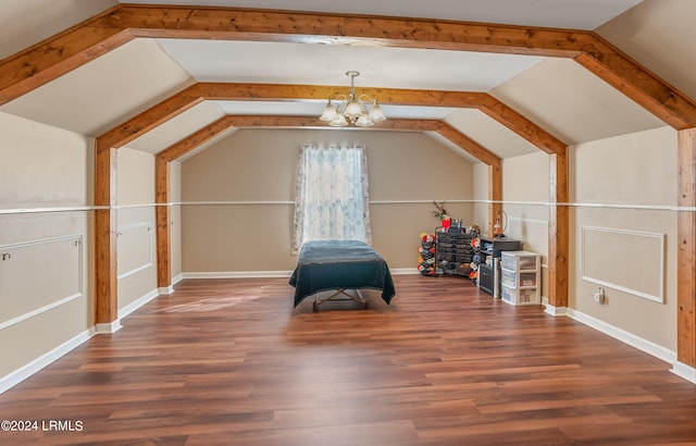 additional living space with lofted ceiling, dark hardwood / wood-style flooring, and a chandelier