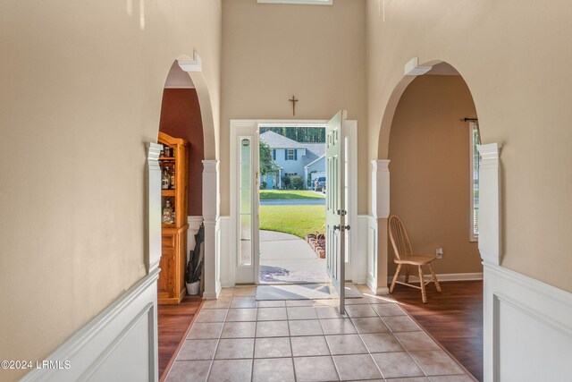 tiled foyer entrance with a high ceiling