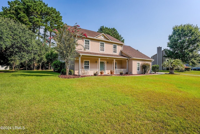 view of front of property featuring a porch and a front yard