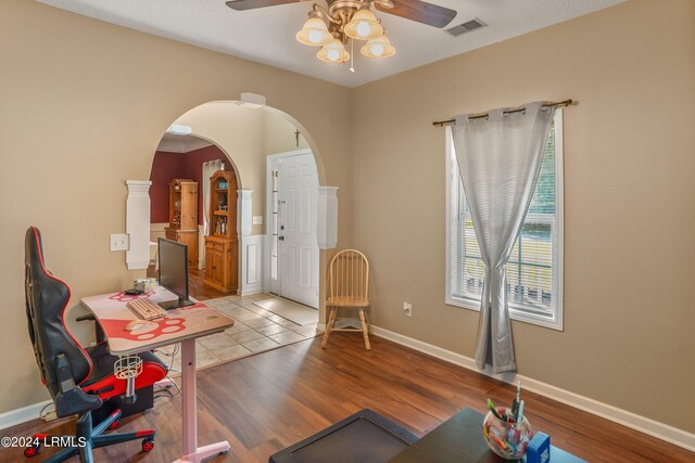 office area with ceiling fan and light hardwood / wood-style flooring