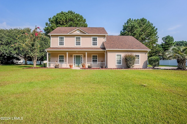 view of front facade with covered porch and a front lawn