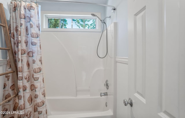 bathroom with shower / bathtub combination with curtain