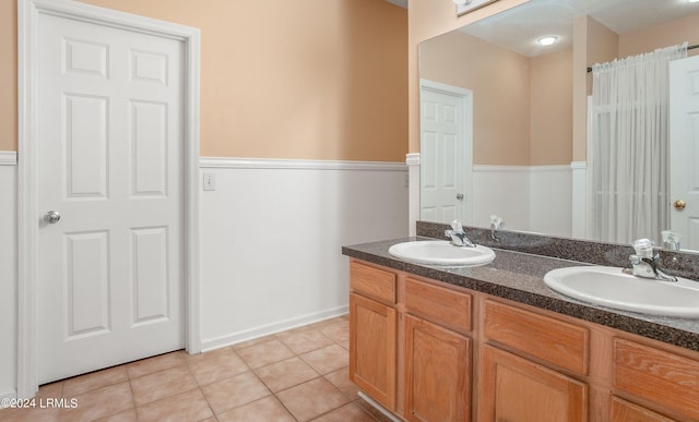 bathroom with tile patterned flooring and vanity