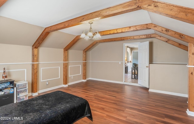 bonus room featuring an inviting chandelier, lofted ceiling, and dark hardwood / wood-style flooring