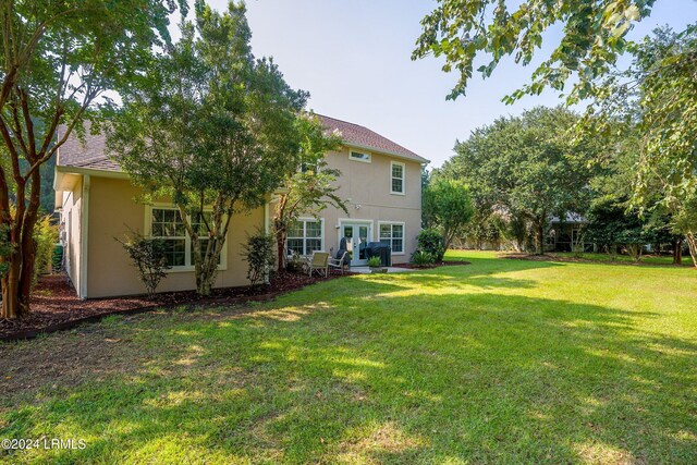 view of yard featuring french doors