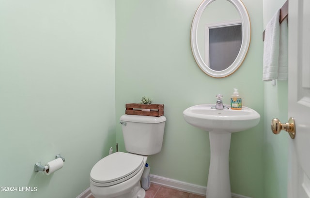 bathroom with tile patterned flooring and toilet