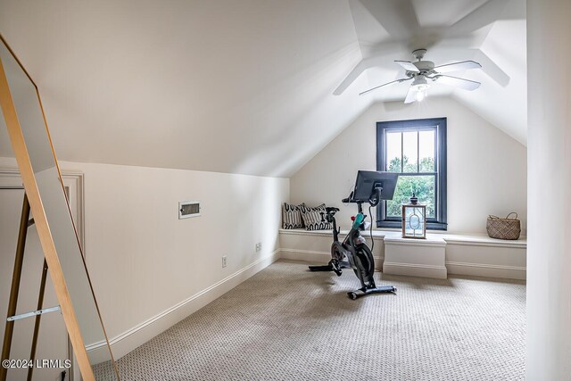 exercise room featuring lofted ceiling, carpet floors, and ceiling fan