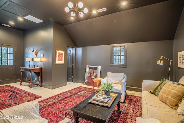 living room featuring lofted ceiling and a notable chandelier