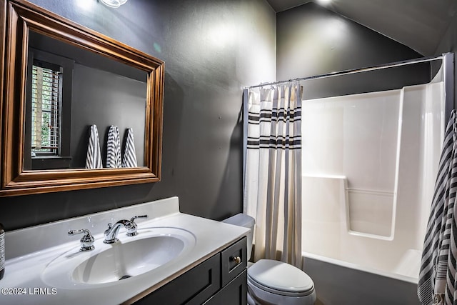 full bathroom featuring shower / tub combo with curtain, vanity, and toilet