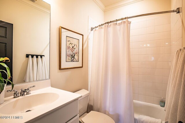 full bathroom with vanity, crown molding, toilet, and shower / bath combo