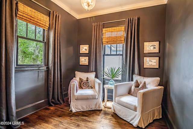 sitting room featuring hardwood / wood-style flooring and crown molding