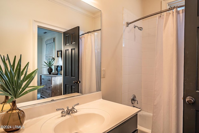 bathroom featuring crown molding, sink, and shower / bath combo with shower curtain