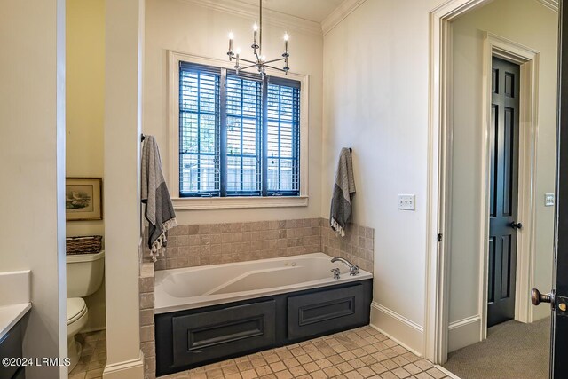 bathroom featuring crown molding, vanity, a bath, toilet, and a chandelier