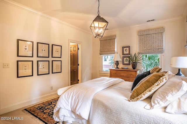 bedroom featuring an inviting chandelier, ornamental molding, and carpet flooring