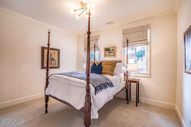 bedroom with ornamental molding, carpet, and a notable chandelier