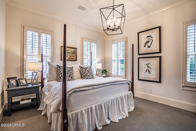 carpeted bedroom featuring crown molding and a chandelier