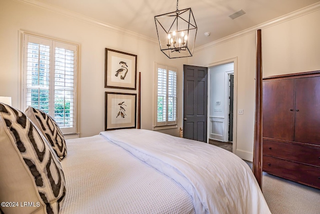 bedroom featuring multiple windows, a notable chandelier, carpet floors, and ornamental molding