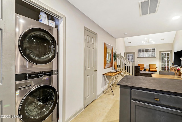 610 E Ave, Bluffton, SC 29910 - clothes washing area with laundry area, baseboards, visible vents, and stacked washer and clothes dryer