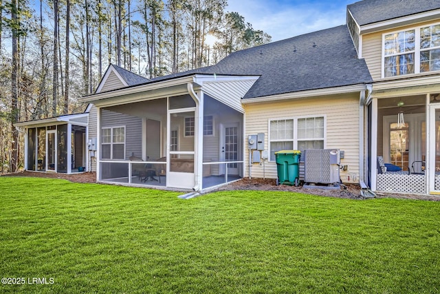 610 E Ave, Bluffton, SC 29910 - back of property featuring a yard, a sunroom, and a shingled roof