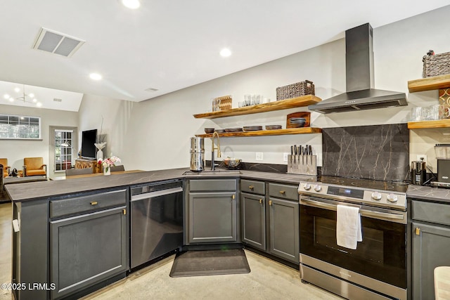 610 E Ave, Bluffton, SC 29910 - kitchen with visible vents, open shelves, a peninsula, appliances with stainless steel finishes, and wall chimney exhaust hood