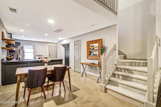 610 E Ave, Bluffton, SC 29910 - dining room featuring stairway, recessed lighting, visible vents, and concrete floors