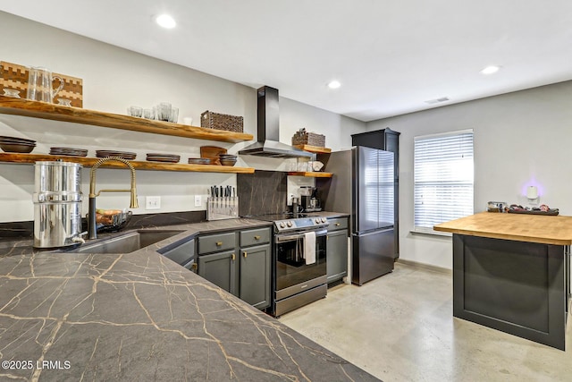 610 E Ave, Bluffton, SC 29910 - kitchen featuring open shelves, recessed lighting, a sink, stainless steel appliances, and wall chimney exhaust hood