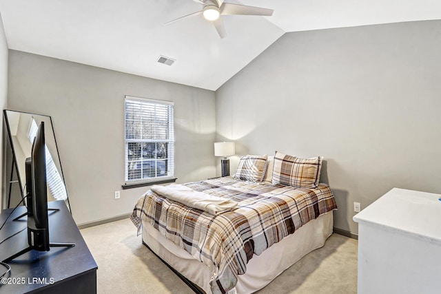 610 E Ave, Bluffton, SC 29910 - bedroom with vaulted ceiling, baseboards, visible vents, and light carpet