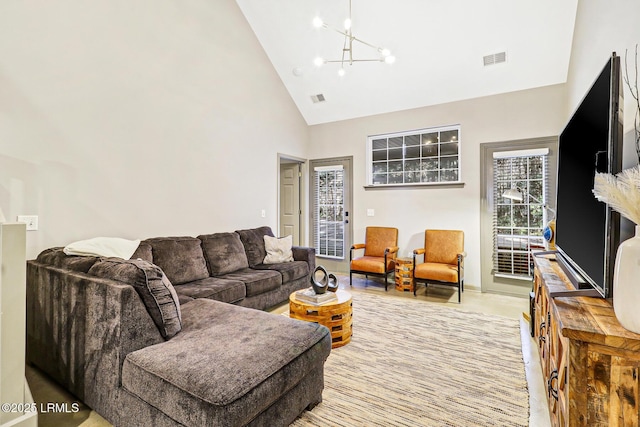 610 E Ave, Bluffton, SC 29910 - living area featuring visible vents, plenty of natural light, high vaulted ceiling, and a chandelier