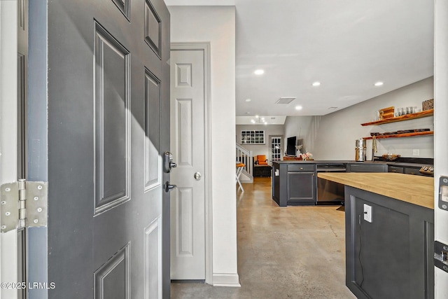 610 E Ave, Bluffton, SC 29910 - kitchen with stainless steel dishwasher, recessed lighting, concrete floors, a peninsula, and butcher block counters