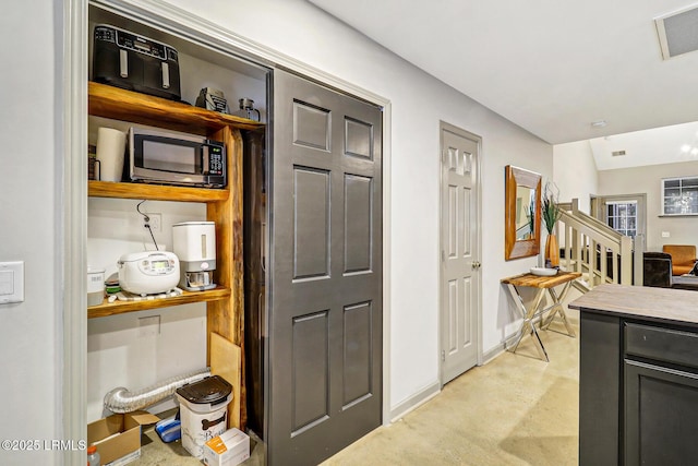 610 E Ave, Bluffton, SC 29910 - kitchen with visible vents, finished concrete flooring, light countertops, and baseboards