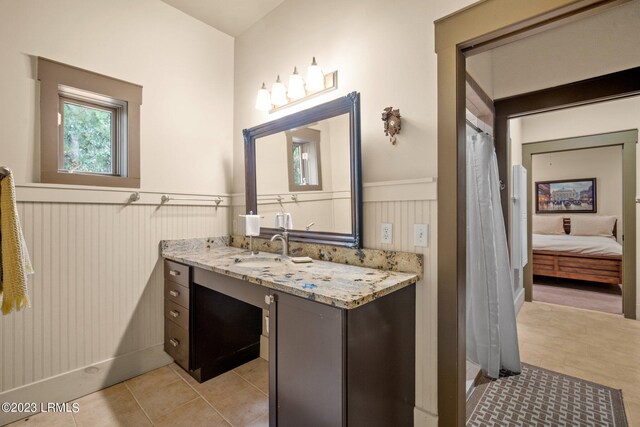 bathroom with vanity and tile patterned floors