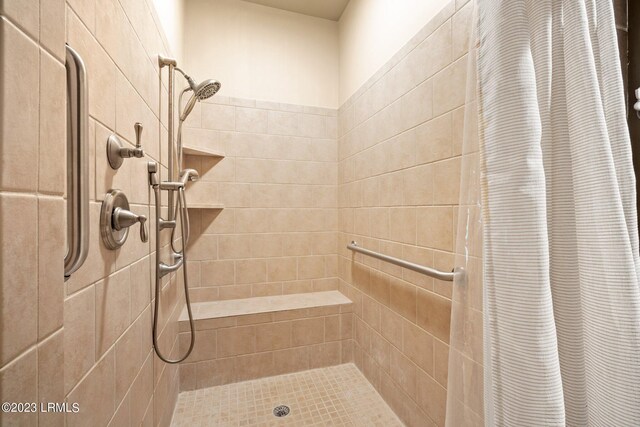 bathroom featuring curtained shower