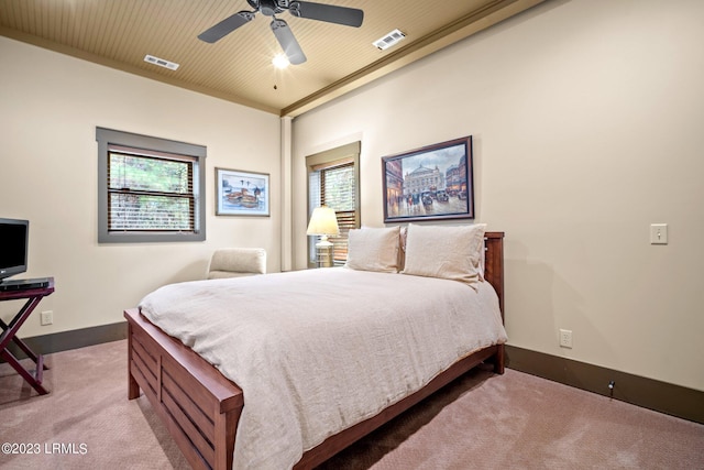 bedroom featuring light colored carpet and ceiling fan