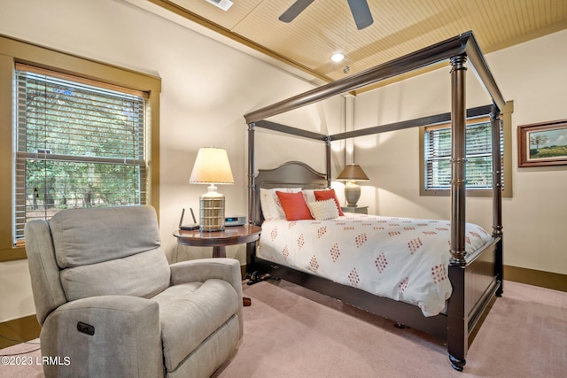 carpeted bedroom with ceiling fan and wooden ceiling