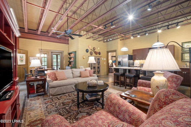 living room featuring track lighting and ceiling fan