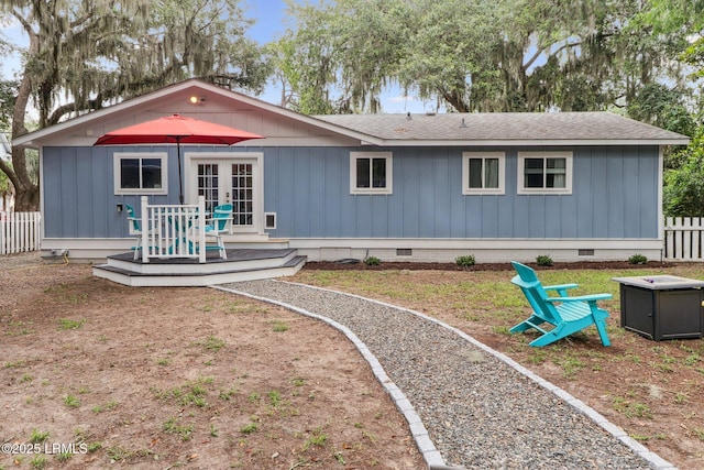 1617 Paris Ave W, Port Royal, SC 29935 - back of property with crawl space, a wooden deck, french doors, and a shingled roof