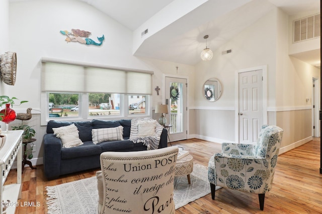 1617 Paris Ave W, Port Royal, SC 29935 - living area featuring high vaulted ceiling, plenty of natural light, and hardwood / wood-style flooring