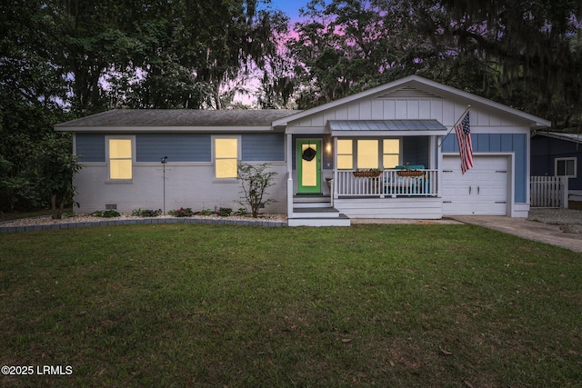 1617 Paris Ave W, Port Royal, SC 29935 - ranch-style home with board and batten siding, covered porch, a lawn, brick siding, and concrete driveway