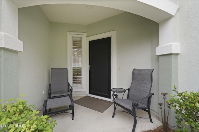 193 Landing Ln, Bluffton, SC 29909 - entrance to property featuring stucco siding and a patio