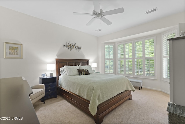 193 Landing Ln, Bluffton, SC 29909 - bedroom with multiple windows, light carpet, and ceiling fan