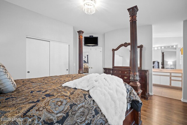50 Padgett Dr, Bluffton, SC 29909 - bedroom with ensuite bathroom, decorative columns, a closet, and wood finished floors