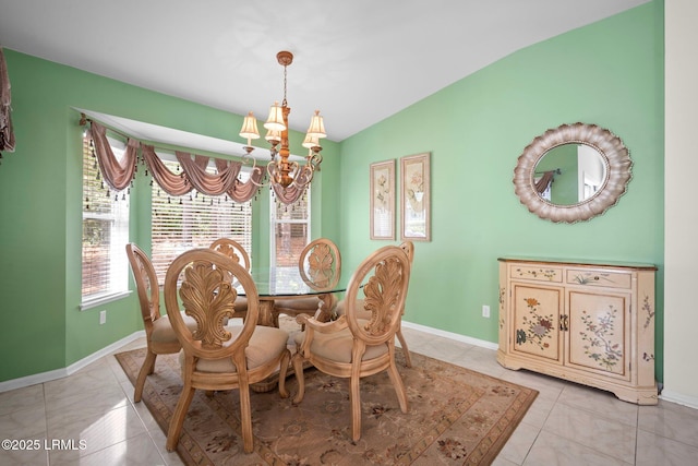 50 Padgett Dr, Bluffton, SC 29909 - dining room featuring light tile patterned floors, baseboards, a chandelier, and vaulted ceiling