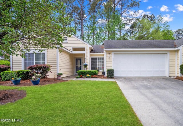 50 Padgett Dr, Bluffton, SC 29909 - ranch-style home with an attached garage, roof with shingles, aphalt driveway, and a front lawn
