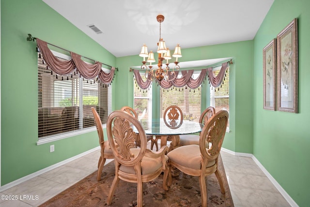 50 Padgett Dr, Bluffton, SC 29909 - dining area with visible vents, baseboards, an inviting chandelier, vaulted ceiling, and tile patterned floors
