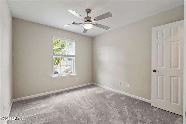 unfurnished room with light carpet and ceiling fan