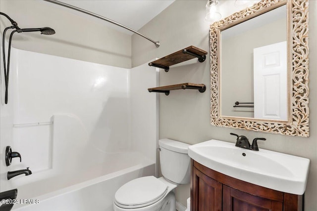 full bathroom featuring vanity, bathtub / shower combination, and toilet