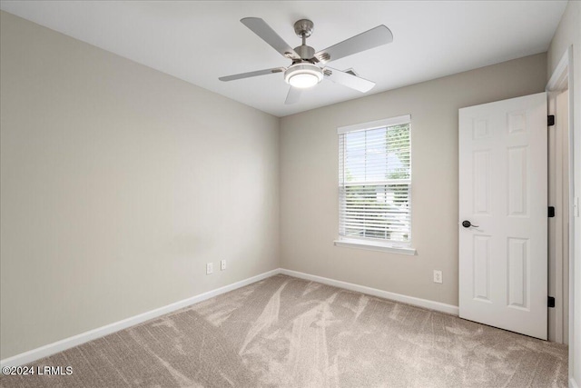 unfurnished room with carpet floors and ceiling fan